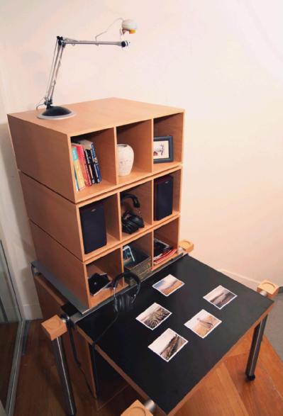 Piece of furniture incorporating a table with photos on
the tabletop