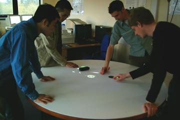 Robot Ships with four students interacting in 
the Visual Systems Lab